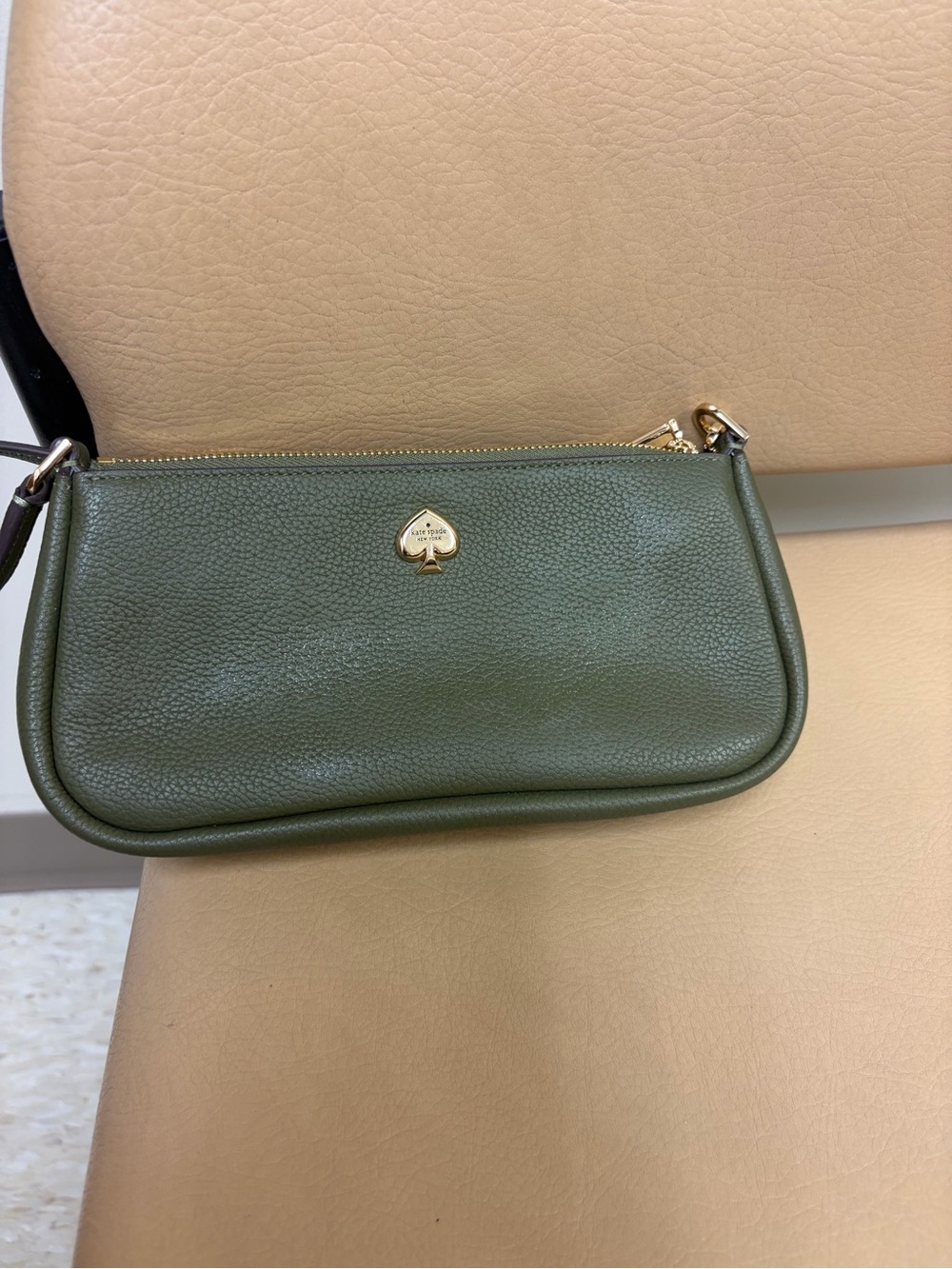kate spade olive green pebbled leather wristlet with gold spade emblem